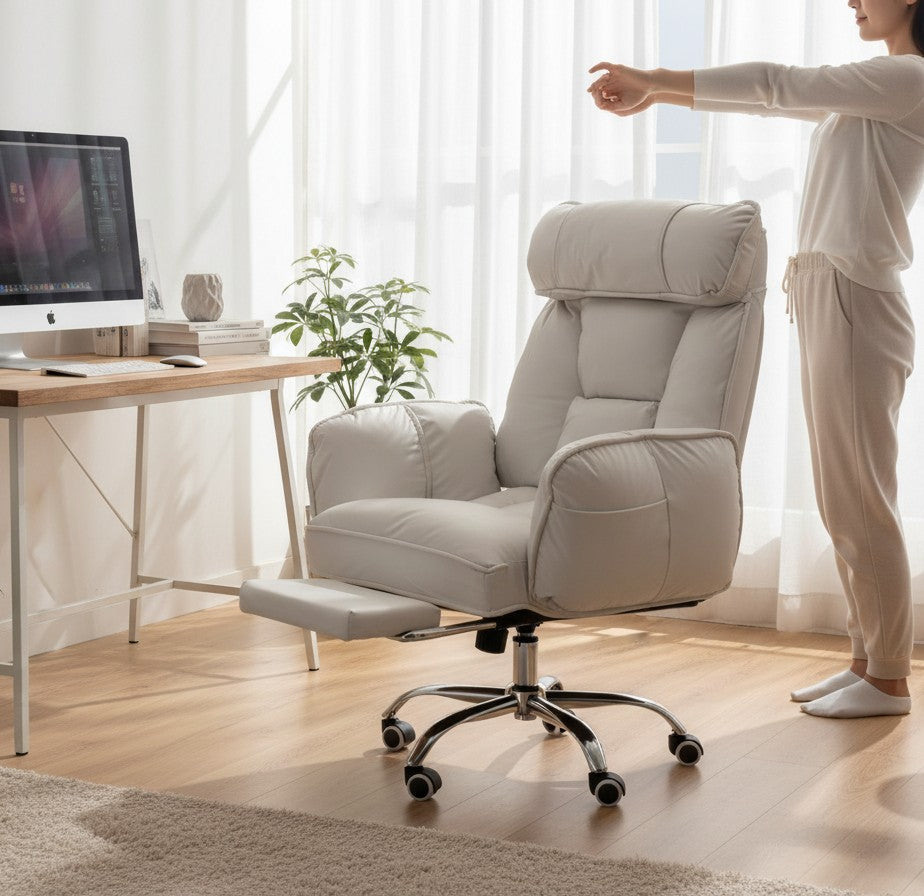 ERGOWAVE L1 at a desk from behind, showing the high backrest and the five-spoke base